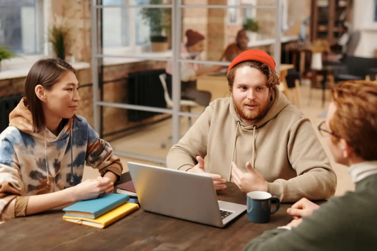 Three people having a meeting.
